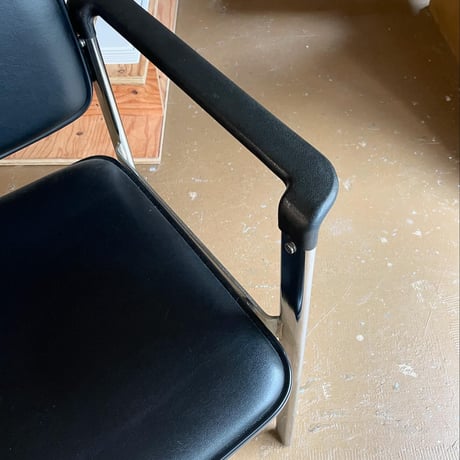 USED METAL LEG VINYL LEATHER STAKING ARM CHAIR