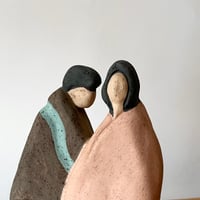 USED CERAMIC COUPLE STATUE
