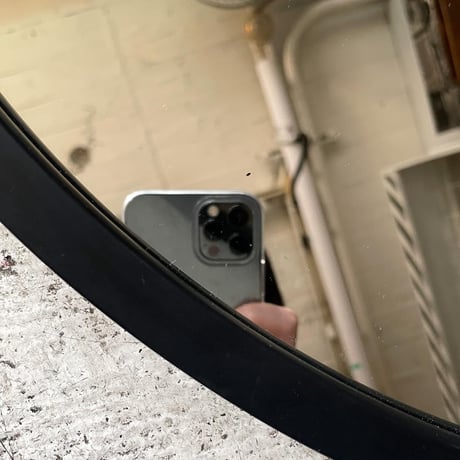 USED "UMBRA" RUBBER FLAME WALL MIRROR