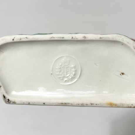 USED CERAMIC BRANDY BOTTLE