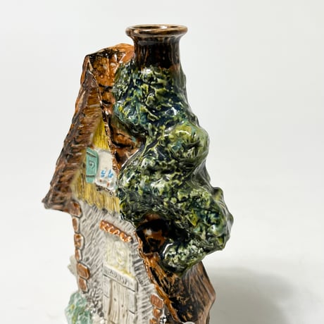 USED CERAMIC BRANDY BOTTLE