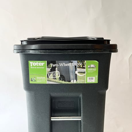 USED “TOTER” 48 GALLON TWO WHEELS TRASH CAN