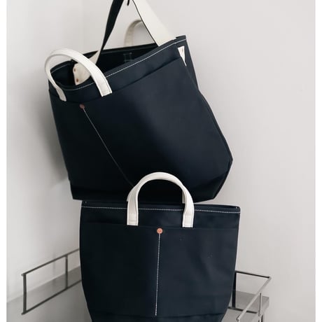 This is a(n) Ex. Leather Handle Base Tote L