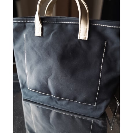 This is a(n) Ex. Leather Handle Base Tote S