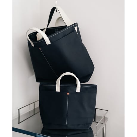 This is a(n) Ex. Leather Handle Base Tote S