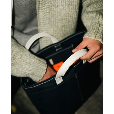 This is a(n) Ex. Leather Handle Base Tote S