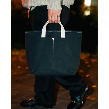 This is a(n) Ex. Leather Handle Base Tote S