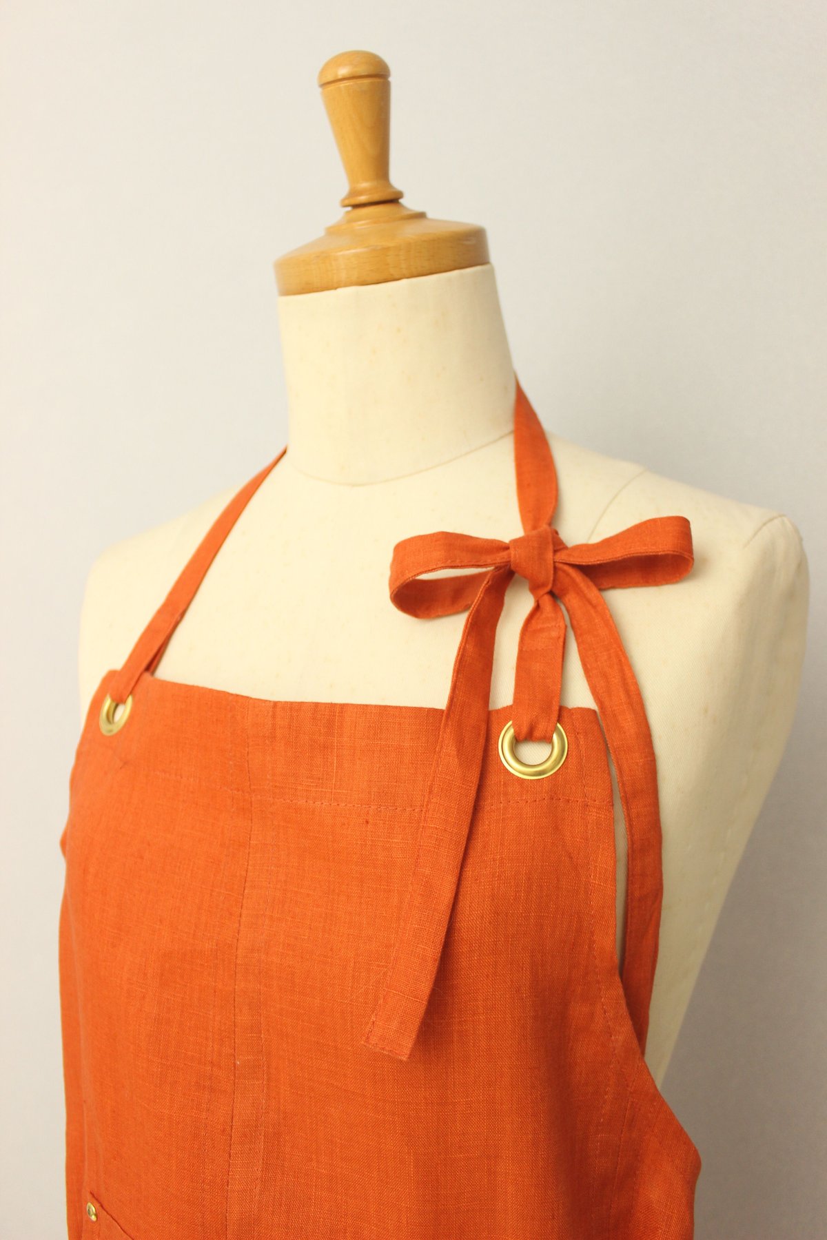 Eyelet switching apron】Orange | Rinyu