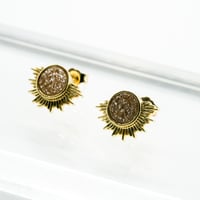 オレンジドゥルージーの太陽ピアス