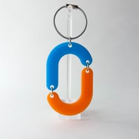 capsule key charm