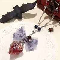 『魔女の秘密の魔法小瓶〜月夜の守護の魔法〜』スワロフスキーとガーネットのマジカルペンダント