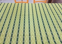 （端側日焼け変色）緑色のミンサー柄（いつ（五つ）の世（四つ）までも）の紅型（びんがた）布。大きい柄の沖縄柄綿生地。Made in JAPAN