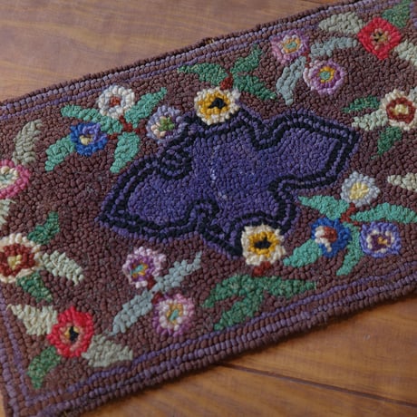 Small floral hooked rug