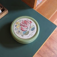 Cans with flower motifs