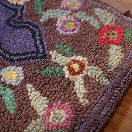 Small floral hooked rug