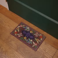 Small floral hooked rug