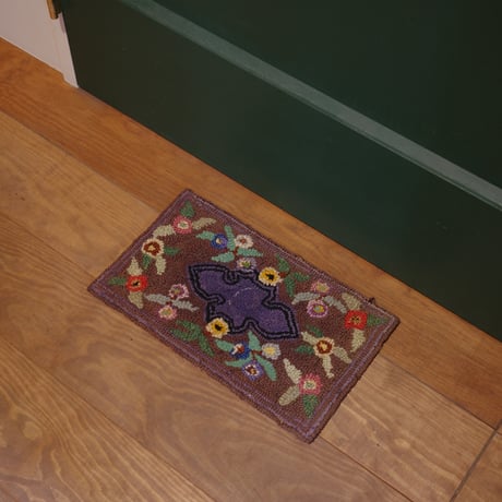 Small floral hooked rug