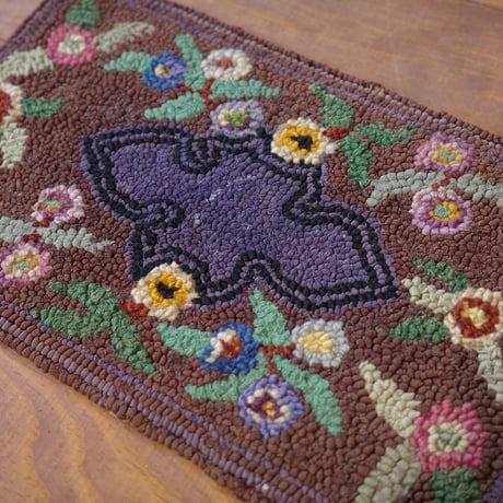 Small floral hooked rug