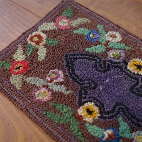 Small floral hooked rug
