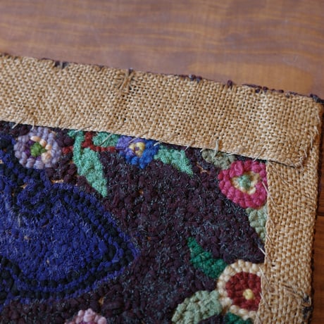 Small floral hooked rug