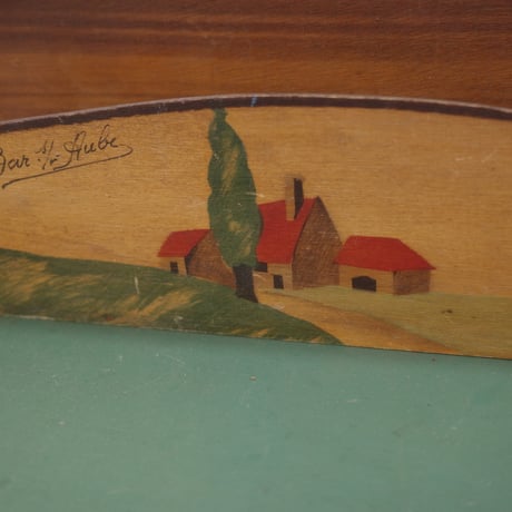 Letter rack of a red-roofed house on a hill