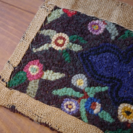 Small floral hooked rug