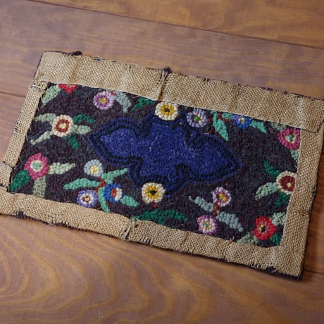 Small floral hooked rug