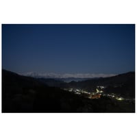 夜の北アルプスと街明かり
