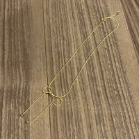 Dangling Gold Ribbon Necklace
