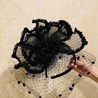 Pleated black head dress