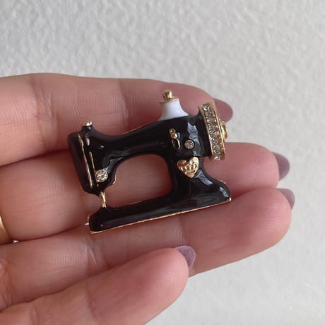 Sewing machine brooch