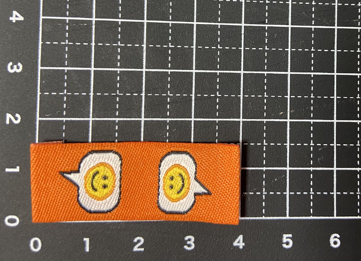 折り刺繍タグ にこちゃんオレンジ 5枚 | タグ屋ヤスオ