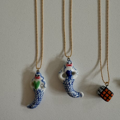 Tiny ceramic mermaid