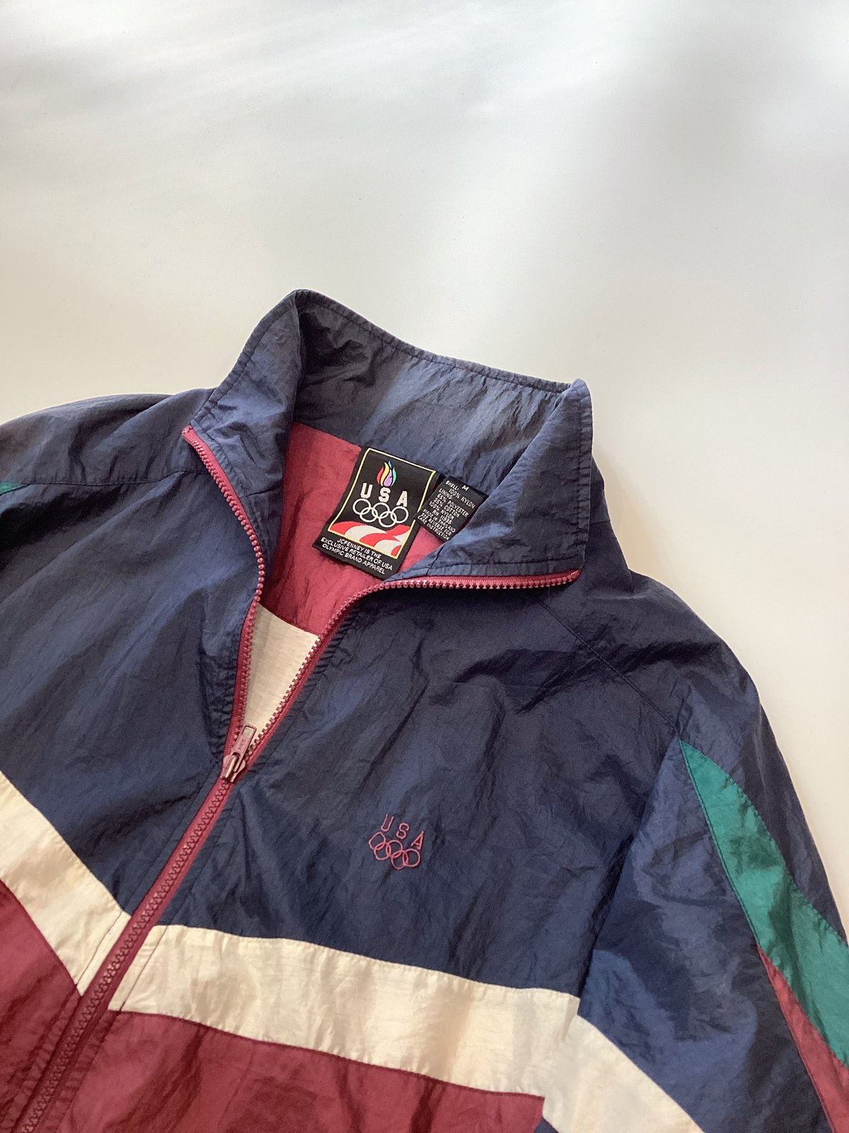 90s JCPenney ナイロンジャケット オリンピック 高配色 XL A88 J.C.Penney】90's オリンピックナイロントラックジャケット