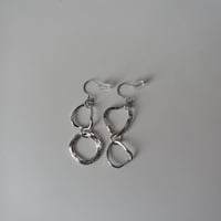 double  hoop ring pierce