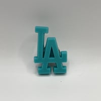 "LA" pins turquoise