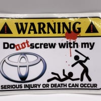 "WARNING" sticker / toyota