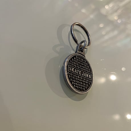 SKATE JAWN "Sewer Cap Metal Keychain"