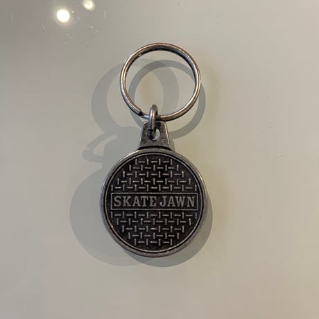 SKATE JAWN "Sewer Cap Metal Keychain"