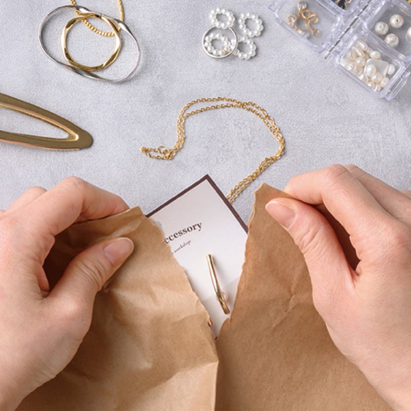 テープのいらない梱包紙 | 株式会社 田村商店