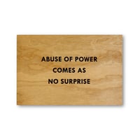 Jenny Holzer / Abuse of Power Comesas No Surprise Wooden Postcard