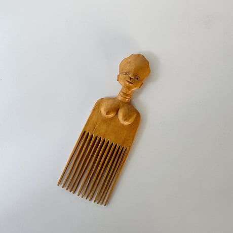 African effigy wooden comb
