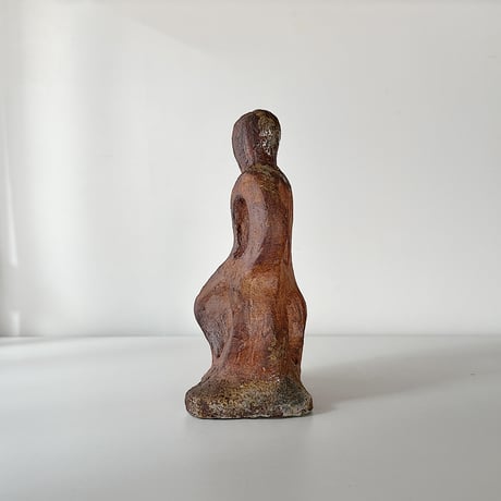 object crouching 70s