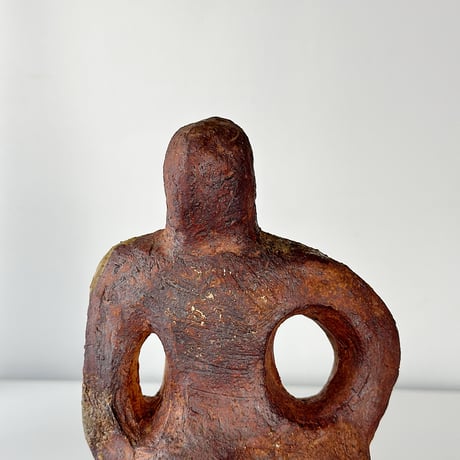 object crouching 70s