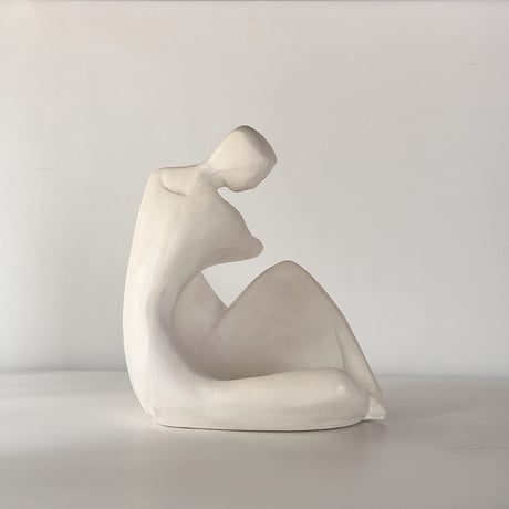 vintage object woman sitting kneel up 80s USA