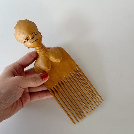 African effigy wooden comb