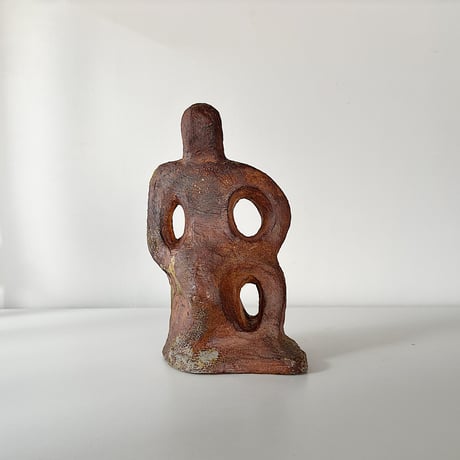 object crouching 70s