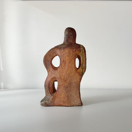 object crouching 70s