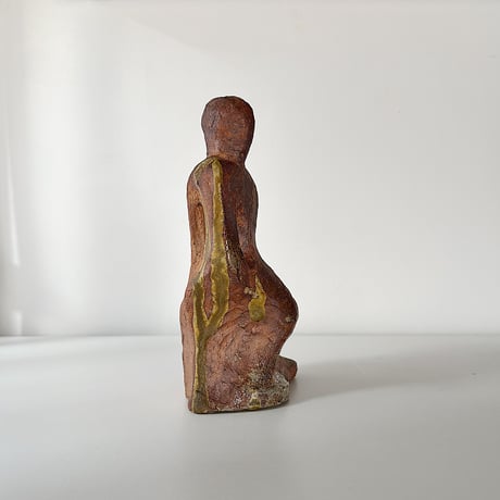 object crouching 70s