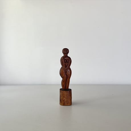 wood carved small woman 30s